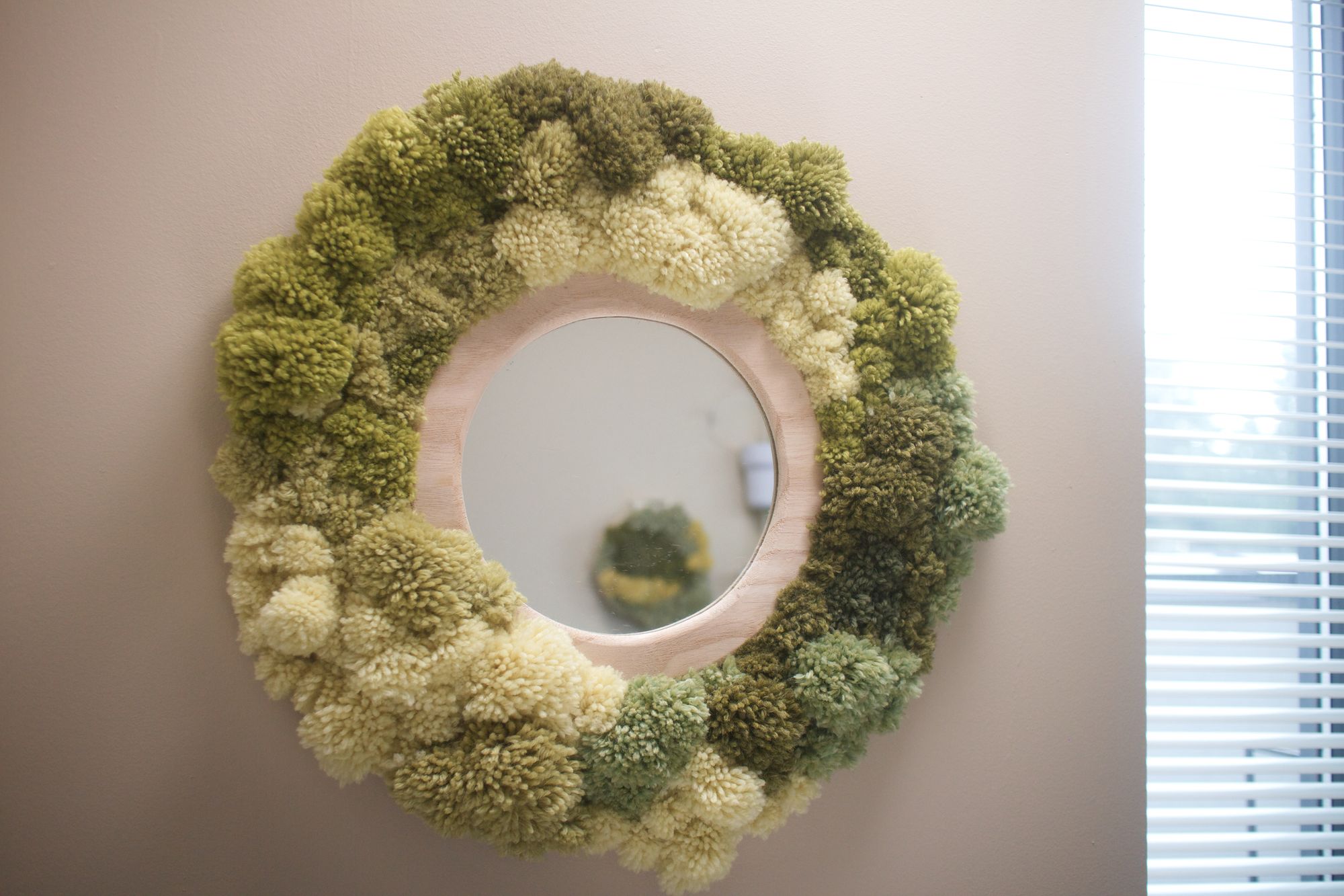 DIY pom pom moss wall art